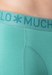 Close-up van een groene Muchachomalo boxershort met logo op de band.