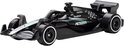 Zwarte Formule 1 auto met groene accenten en 'PETRONAS' logo.