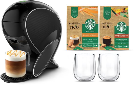 Machine à café Krups noire avec une tasse latte macchiato, deux paquets de dosettes de café Starbucks et deux tasses en verre.