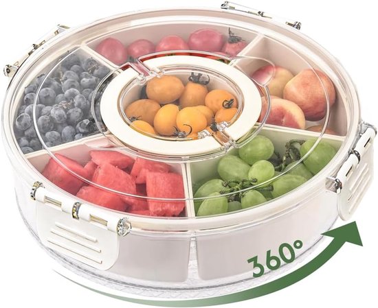 Gevulde snackbox met zes vakken: blauwe bessen, pruimen, perziken, druiven, stukjes watermeloen en mini-tomaten. Met draaischijf en 360° graden pijl.