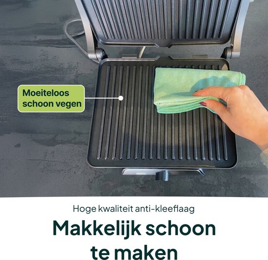 Hand veegt met groene doek over de grillplaten. "Moeiteloos schoon vegen", "Hoge kwaliteit anti-kleeflaag", "Makkelijk schoon te maken".