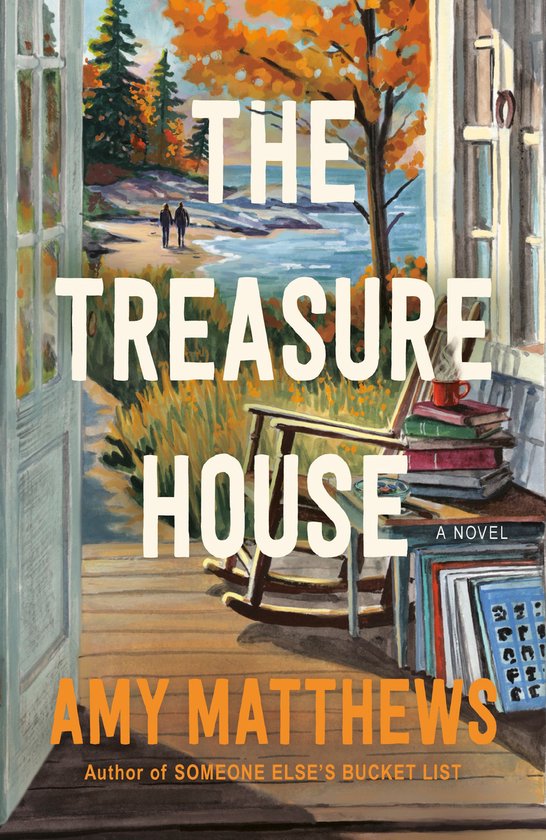 Boekcover met de titel "The Treasure House" van Amy Matthews. Een schilderij van een rockerstoel met boeken, uitzicht op een meer en herfstbomen.
