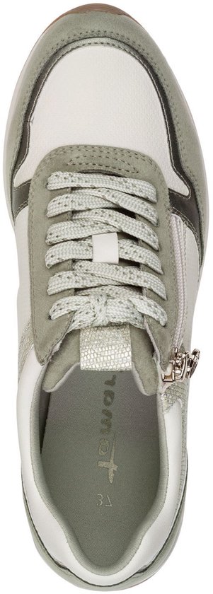 Zijzicht van een groene en witte Tamaris sneaker met veter en ritssluiting.