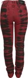 Achterkant van een rode skinny jeans met zwarte batikprint.