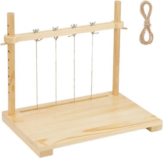 Appareil en bois pour reliure avec cinq cordes et une bobine de corde de chanvre.