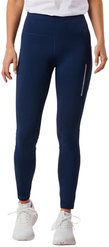Donkerblauwe legging met zakken en zilveren reflecterende streep op de zijkant.