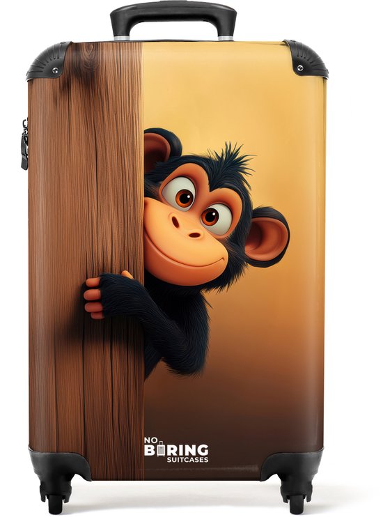 Kinderkoffer met een lachende aap achter een houten muur. Zwart met oranje/geel verloop.