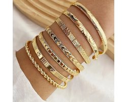 Set van 7 goudkleurige bangle armbanden voor dames met gegraveerde en gedraaide motieven – brede dames armbanden set