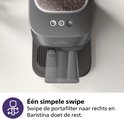 Detail van het uitwerp mechanisme van de Philips Baristina volautomatische espressomachine.