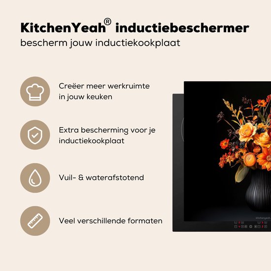 Zwarte inductiebeschermer met bloemenboeket, biedt extra werkruimte en bescherming.