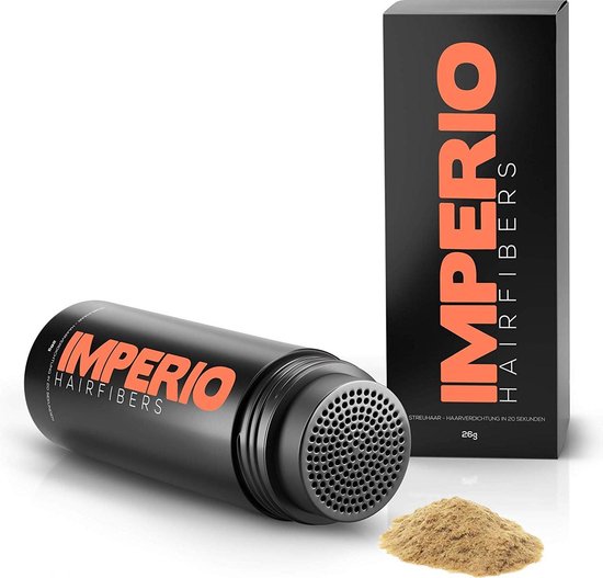 Flesje en doosje van IMPERIO haarvezels, met wat poeder ernaast. De verpakking is zwart met oranje tekst.