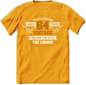 64 Jaar Legend T-Shirt | Goud - Wit | Grappig Verjaardag en Feest Cadeau Shirt | Dames - Heren - Unisex | Tshirt Kleding Kado | - Geel - 3XL