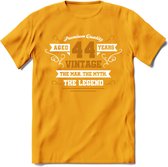 44 Jaar Legend T-Shirt | Goud - Wit | Grappig Verjaardag en Feest Cadeau Shirt | Dames - Heren - Unisex | Tshirt Kleding Kado | - Geel - L
