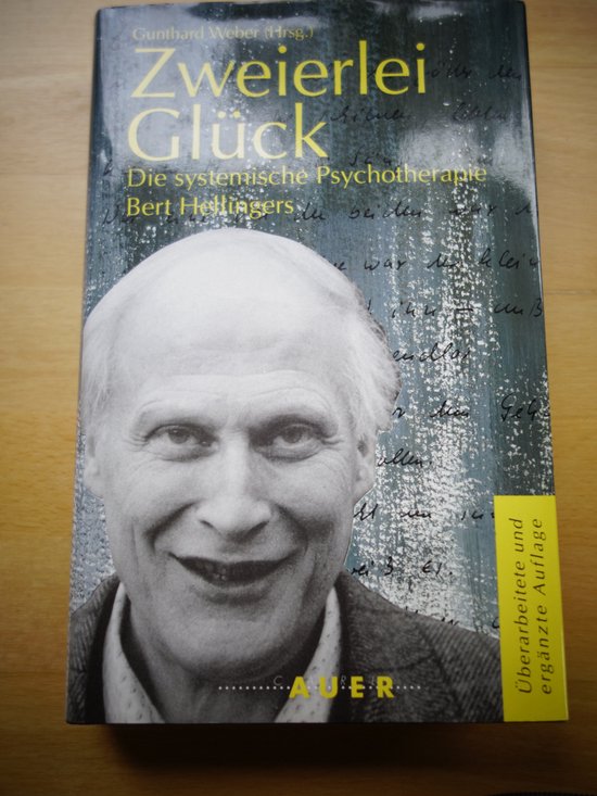 Boek 'Zweierlei Glück' met portret van Bert Hellinger en de titel in het geel.