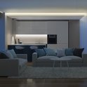Moderne woonkamer en keuken met witte en grijze kasten, verlicht door zachte witte led-verlichting.