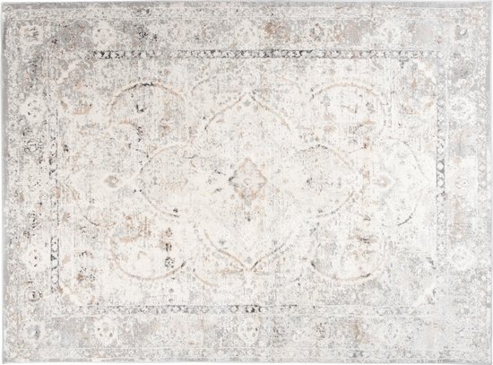 Un tapis vintage beige clair avec un motif détaillé dans des tons gris et marron.