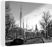 Canvas Schilderij Winterlandschap langs de grachten in Groningen - zwart wit - 40x30 cm - Wanddecoratie