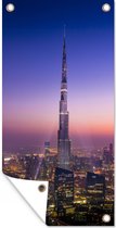 Wanddecoratie buiten Een zeer bijzondere lucht bij avondschemering boven de Burj Khalifa van Dubai - 80x160 cm - Tuindoek - Buitenposter