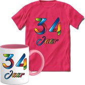 34 Jaar Vrolijke Verjaadag T-shirt met mok giftset Roze | Verjaardag cadeau pakket set | Grappig feest shirt Heren – Dames – Unisex kleding | Koffie en thee mok | Maat 3XL