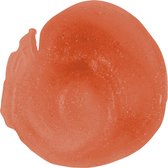 Een vlek oranje lippenstift met fijne glitters.
