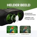 Zwarte TravelHawk verrekijker met groene lenzen, toont helder beeld.