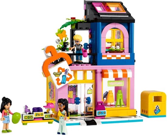 Magasin de vêtements vintage LEGO Friends avec figurines et une poubelle jaune.