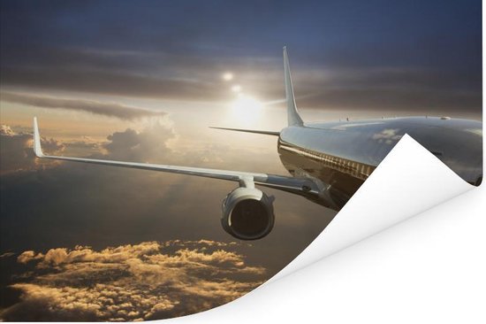 Un avion à réaction survole les nuages Poster 120x80 cm - Tirage photo sur Poster (décoration murale salon / chambre)