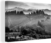 Canvas Schilderij Mist boven het ommuurde San Gimignano in Italië bij zonsopgang - zwart wit - 60x40 cm - Wanddecoratie