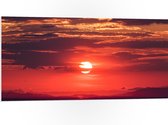WallClassics - PVC Schuimplaat- Ondergaande Zon achter Wolken - 100x50 cm Foto op PVC Schuimplaat