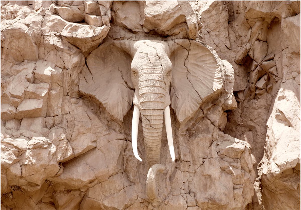 Fotobehangkoning - Behang - Vliesbehang - Fotobehang Olifant van Steen - Elephant Carving (South Africa) - 450 x 315 cm