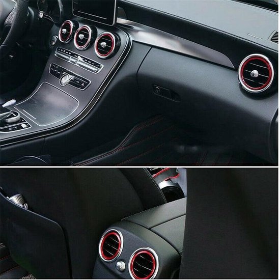 Interieur Mercedes C Klasse W205 met ventilatieroosters en rode ringen, lederlook dashboard en rode stiksels.