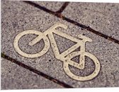 WallClassics - PVC Schuimplaat- Fiets Logo op Stenen - 100x75 cm Foto op PVC Schuimplaat