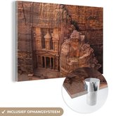 MuchoWow® Glasschilderij 90x60 cm - Schilderij acrylglas - Oude tempel uit zandsteen gesneden Petra in Jordanië - Foto op glas - Schilderijen