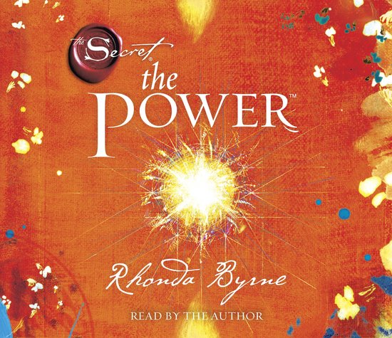 Boekcover 'The Secret The Power' door Rhonda Byrne, met op oranje achtergrond een sprankelende lichtexplosie en de titel 'The Power'.