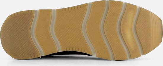 Semelle d'un mocassin bleu marine avec profil ondulé.