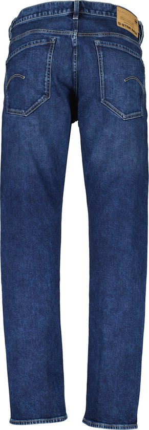 Donkerblauwe G-Star jeans met rechte pijpen, achterkant zichtbaar.