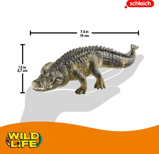 Een speelgoedkrokodil van Schleich, 19 cm lang en 3,7 cm hoog, olijfgroen met zwarte patronen.