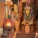 Close-up van de Egyptische puzzel: Farao, sarcofaag, Anubis beeldje en vuurdetail.