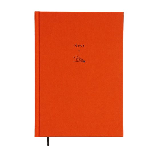 Oranje notitieboek met de tekst 'Ideas' en een lijntekening van een vallende ster.