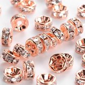 Rhinestone spacer beads, rose goud met heldere chatons, 8x4mm. Verkocht per 50 stuks !