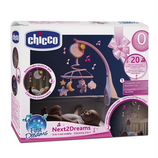 Doos van de Next2Dreams roze muziekmobiel met baby's in een wieg en kinderstoel.