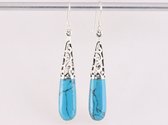 Lange opengewerkte zilveren oorbellen met blauwe turkoois
