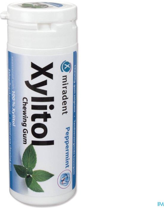 Witte Miradent Xylitol kauwgom potje met pepermunt smaak en groene bladeren.