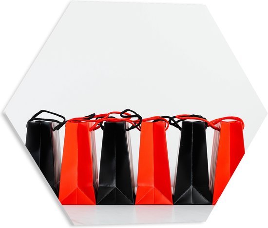 PVC Schuimplaat Hexagon - Foto van Verzameling Rode en Zwarte Cadeautasjes tegen Witte Achtergrond - 40x34.8 cm Foto op Hexagon (Met Ophangsysteem)