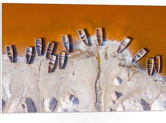 WallClassics - PVC Schuimplaat- Bovenaanzicht van Oude Houten Vissersboten aan Oranje Getinte Zee - 75x50 cm Foto op PVC Schuimplaat