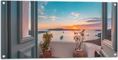 Tuinposter – Uitzicht op Zonsondergang in de Oceaan vanaf Grieks Balkon - 100x50 cm Foto op Tuinposter (wanddecoratie voor buiten en binnen)