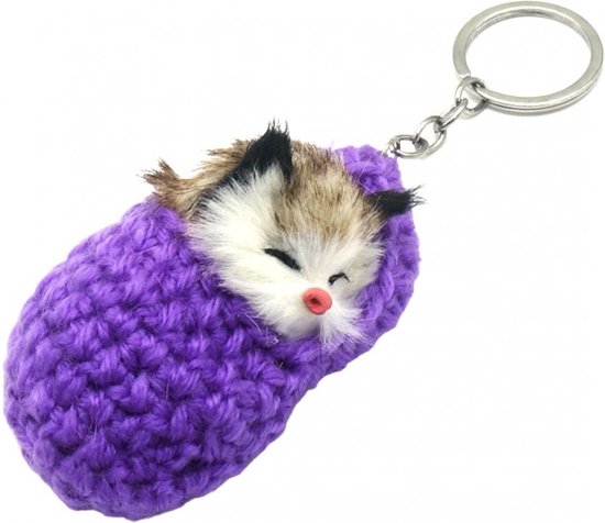 Un chat mignon et doux qui dort dans une pantoufle. Un joli porte-clés à attacher à votre trousseau de clés, sac ou sac à dos par exemple. Pour soi ou en cadeau.