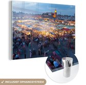 MuchoWow® Glasschilderij 150x100 cm - Schilderij acrylglas - Djemaa El Fna-plein in Marokko bij schemering - Foto op glas - Schilderijen