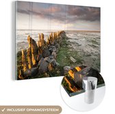 MuchoWow® Glasschilderij 180x120 cm - Schilderij acrylglas - Zee - Stenen - Nederland - Foto op glas - Schilderijen