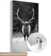 MuchoWow® Glasschilderij 120x180 cm - Schilderij acrylglas - Mannelijk hert lopend door grasveld - zwart wit - Foto op glas - Schilderijen